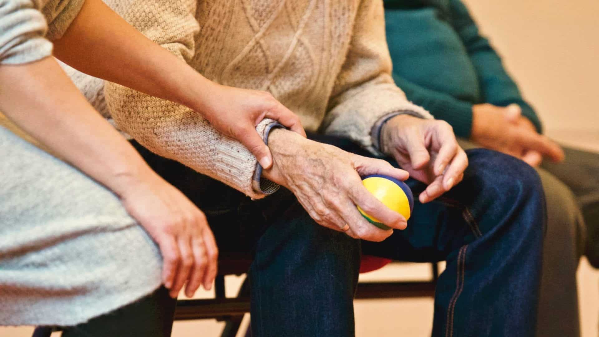 Old man holding a stress ball