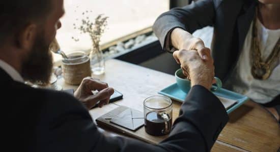 two colleagues shaking hands