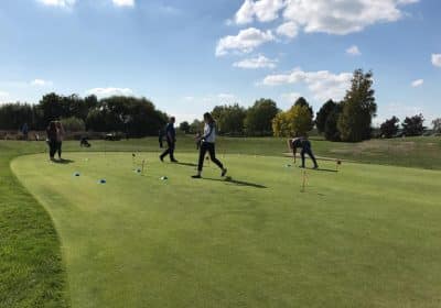 Womens playing golf