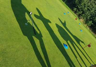 shadow of the golf players