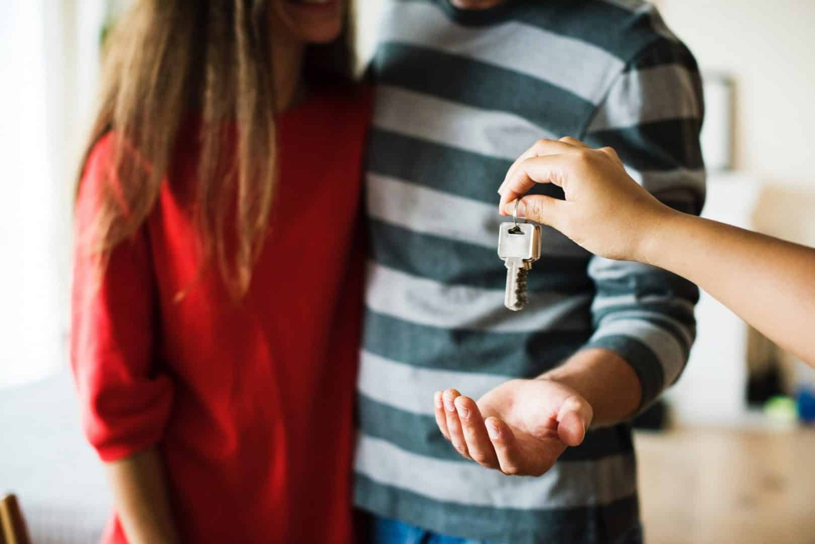 giving out the keys to the new owner