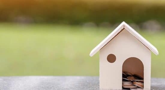a toy house with coins inside