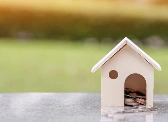 a toy house with coins inside