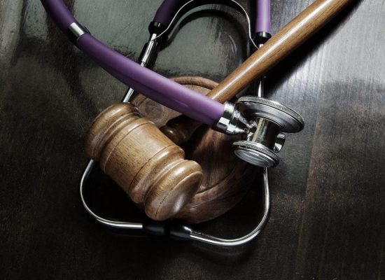 a stethoscope and a wooden gavel