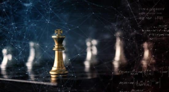 chess pieces with a gold king piece
