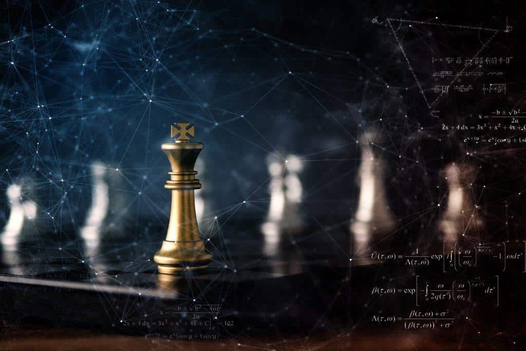chess pieces with a gold king piece
