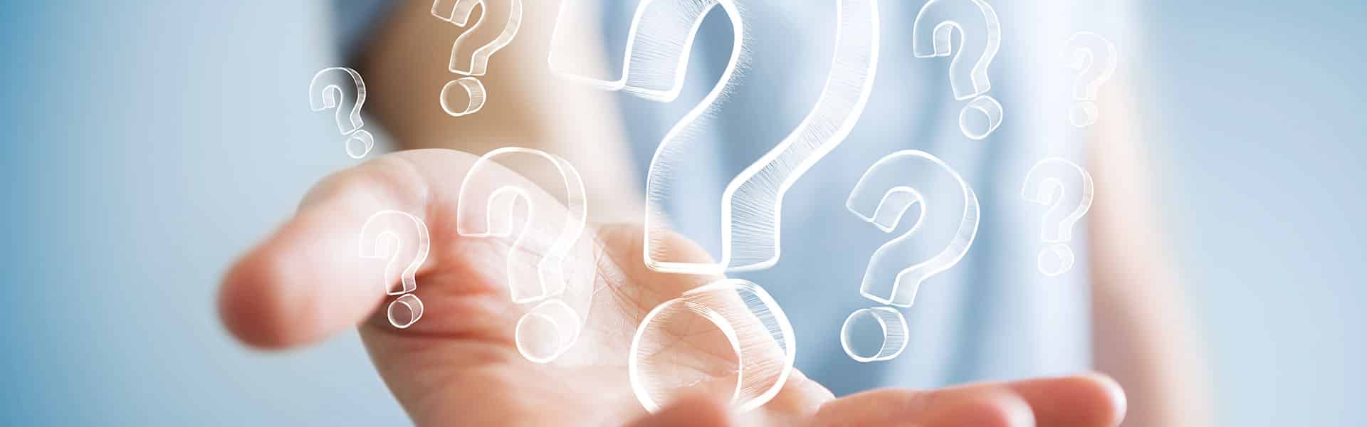 transparent question marks and a hand